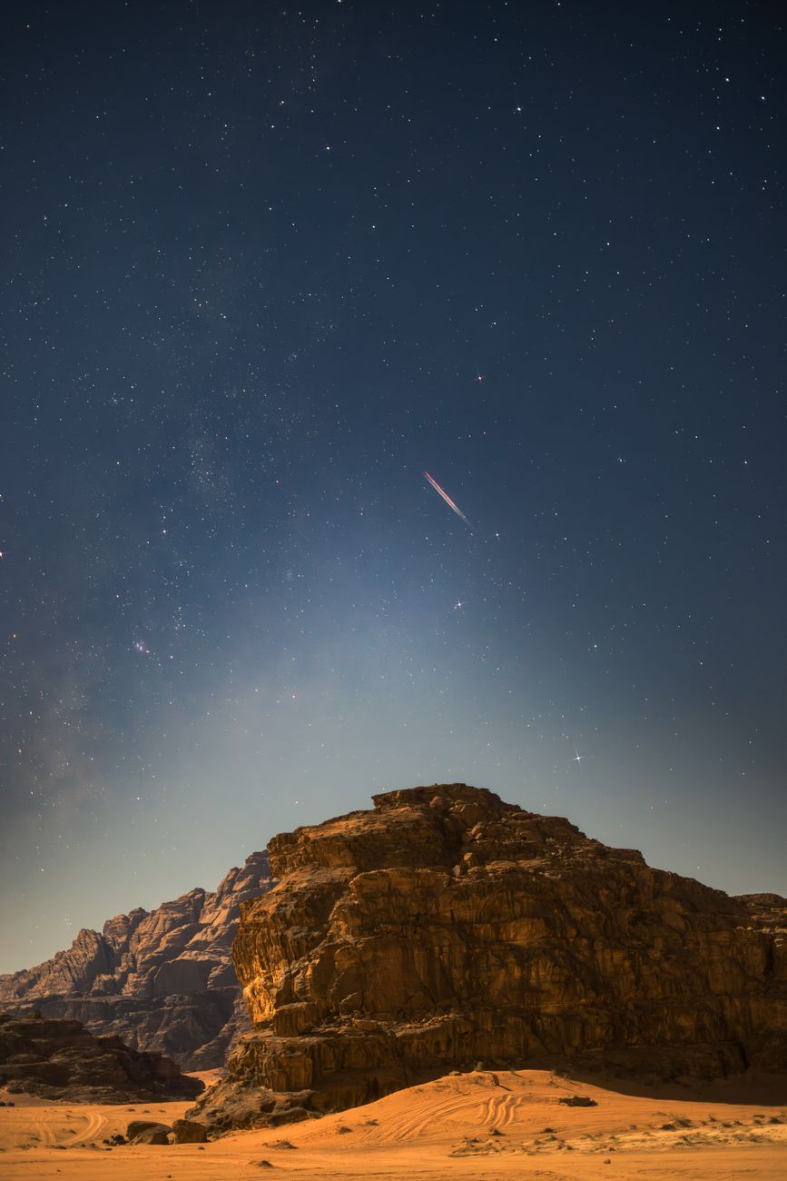 Red canyon under starry sky